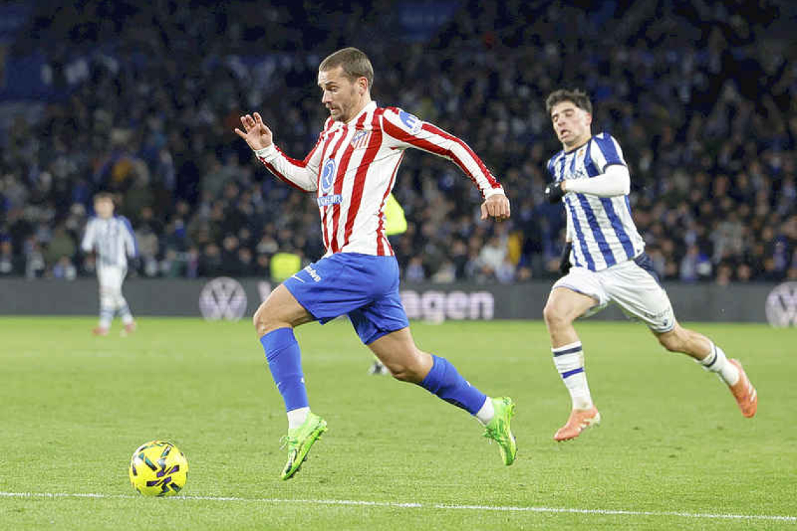Griezmann's free kick seals Atletico Madrid progress